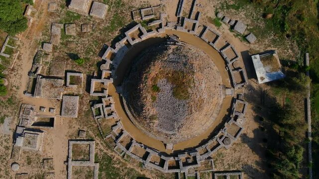 Aerial view of dharmarajika stupa ruins in the beautiful pothohar landscape, Taxila, Pakistan.