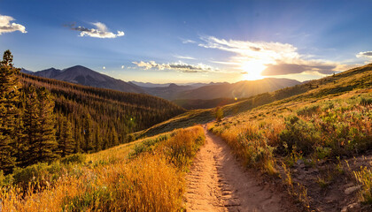 dirt path hiking trail climbs through the colorado mountains with the colorful light of the bright sun shining over the distant horizon