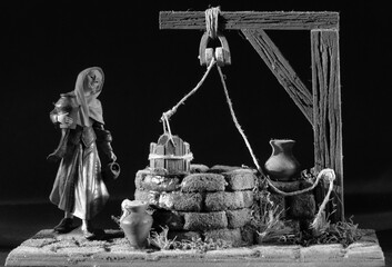 Timeless Village Scene: A Woman at the Well