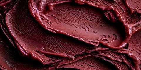 close-up of smooth and creamy cherry ice cream with deep red hues and a rich velvety texture