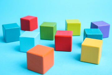 Obraz premium Many colorful cubes on light blue background