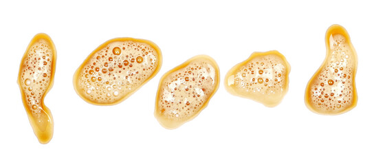 Spilled dark stout beer puddle with foam, isolated on white, top view, clipping path
