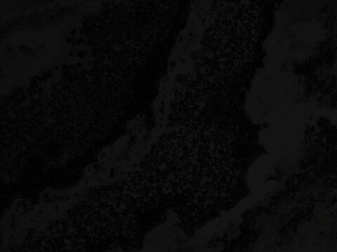 Abstract black stone texture with intricate details, ideal for creating moody and modern visual backgrounds.