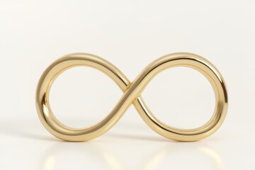 a pair of gold infinity rings on a white background