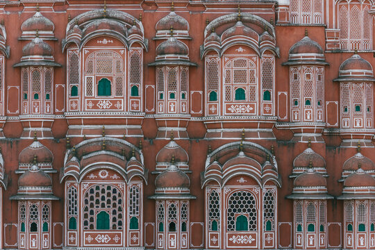 View of the ornate facade and intricate windows of Hawa Mahal, Jaipur, India.