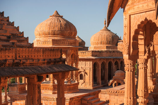 View of intricate sandstone domes and carvings at the sacred site of Bada Bagh, Jaisalmer, India.