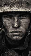 Portrait of dirty soldier wearing helmet looking intensely during war