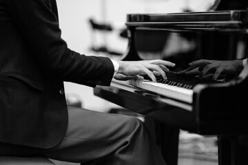 Hands playing piano