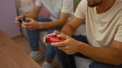 Men playing video games together in a cozy living room, enjoying quality family time.