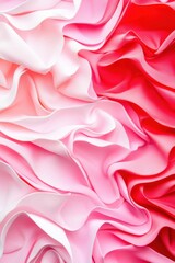 Obraz premium Close up of pink and red satin fabric folds creating a wavy texture for design ideas