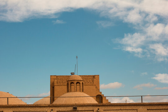 View of the rooftop of an antique mosque made of adobe bricks in Yazd, Iran. 