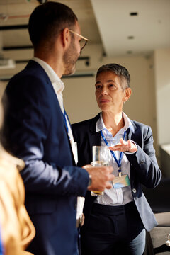 Woman and her colleague have a conversation