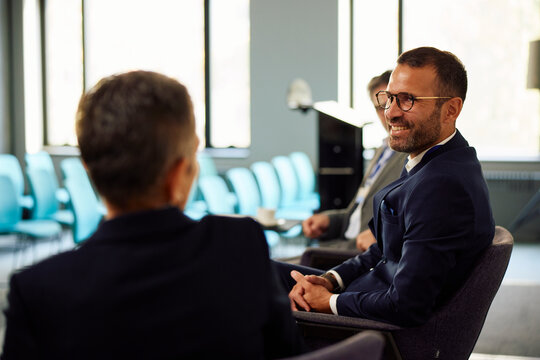 Businesspeople are talking on a conference event