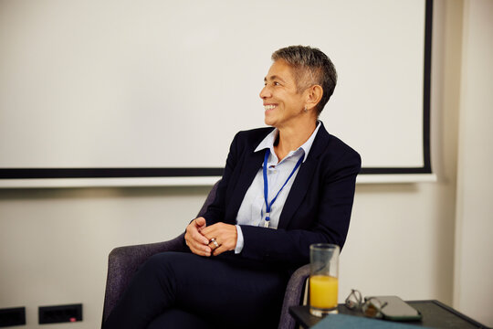 Businesswoman smiles at the conference