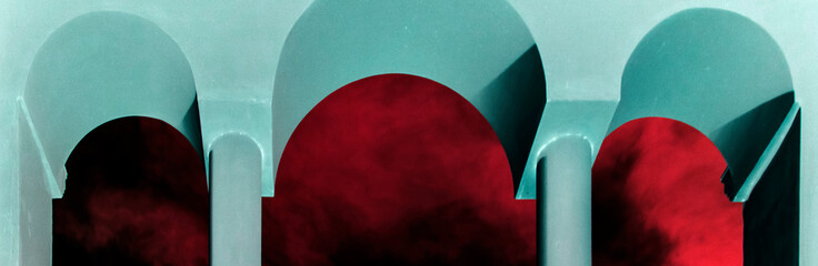 Three arches, bottom view. Three arched doorways and blue sky with clouds. stone arched windows...