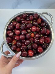 Fresh cherries colander. High quality photo