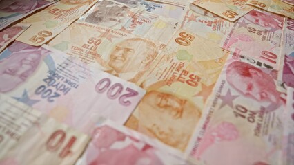 Turkish lira banknotes from various denominations spread out showcasing the currency of turkey.
