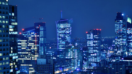 Aerial photography of modern architectural landscapes at night. Lights in the windows of buildings....