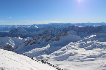 Panoramic aerial view of mountains covered with snow