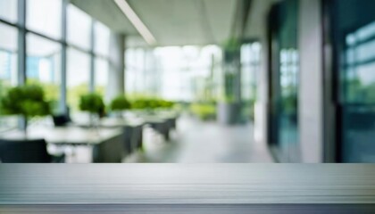 Fototapeta premium minimalistic office environment with blurred green background and reflective wooden table surface ideal for mockups or presentations