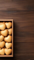 Heart-shaped gingerbread cookies arranged beautifully in a wooden box on a rustic table, ideal for a Valentine's Day celebration