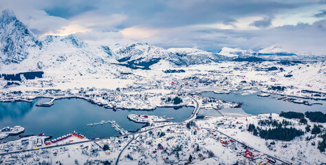 Panoramic morning view from flying drone of Ballstad port, Norway, Europe. Picturesque winter scene of Lofoten Islands. Stunning seascape of Norwegian sea. Traveling concept background. © Andrew Mayovskyy