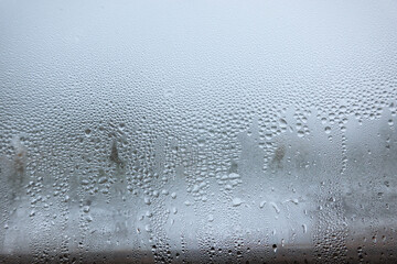 Close-up of fogged glass with many water drops. Background. Texture.