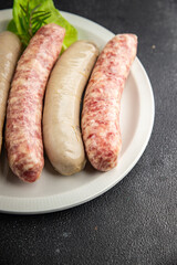 raw sausages pork, beef, chicken, lamb fresh tasty food dish delicious gourmet food background on the table rustic food top view copy space