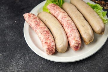 raw sausages pork, beef, chicken, lamb fresh tasty food dish delicious gourmet food background on the table rustic food top view copy space