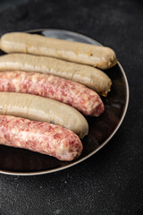 raw sausages pork, beef, chicken, lamb fresh tasty food dish delicious gourmet food background on the table rustic food top view copy space