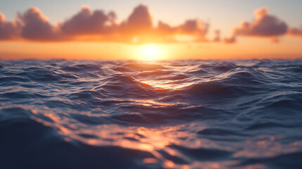 Obraz premium Beautiful sunset over the calm ocean waves reflecting warm colors in the sky