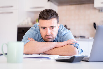 One stressed man calculate bills worried about bankruptcy financial problem