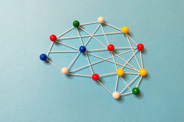 Brain outline made by strings and pins. Mental health and brainstorming concept.