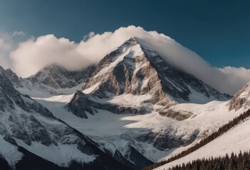 Snowy mountain with clouds and blue sky in the background