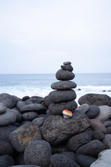 Balance stone tower on sea shore
