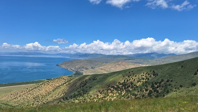 Lake Sevan and Surrounding Hills under a Clear Blue Sky
