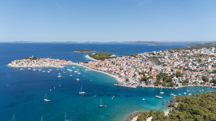 Primosten Town, Adriatic Sea, Croatia. Idyllic Beach on Mediterranean Sea Coast Near Medieval...