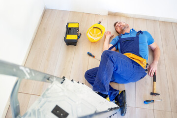 Accident at work prevention concept, worker after job injury