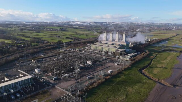 Aerial view of large power station and substation in the United Kingdom. Electricity grid concept