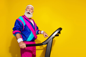 Photo banner of sportive cheerful old man amazed prepare treadmill dressed stylish retro sportswear...