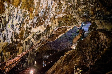 Selective focus on ceiling stalactites in the dark interior of Algar do Carvão, Terceira - Azores PORTUGAL
