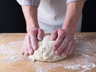 Working with dough on the table.