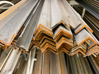 Obraz premium A bunch of various metal angles, made from durable materials, are carefully stacked on top of each other, providing a sturdy foundation for potential construction projects