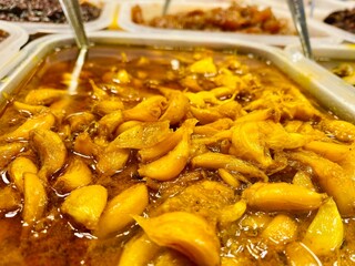 Pickling is a common preservation. Handmade pickle shop on the street. Spicy, Sour and Sweet variety pickles shop on the side of the road. A variety of delicious pickles kept in a glass enclosure.