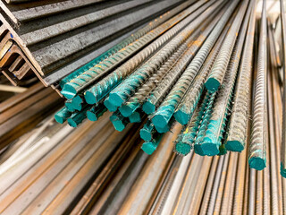 A considerable number of steel bars are meticulously stacked on top of one another, creating a structured arrangement that is often used in construction and engineering projects