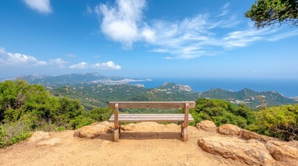 Obraz premium A wooden bench sitting on top of a dirt hill