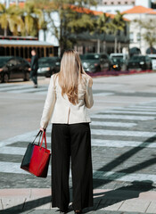woman with bags street miami coral gables 