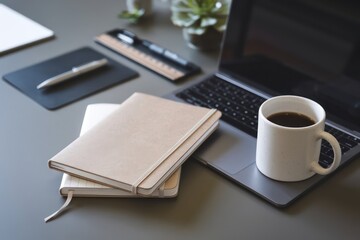 A flat lay of office desk essentials, including a laptop, coffee, and notebooks, with neutral tones