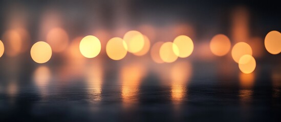 Abstract blurry warm lights reflected on dark surface.