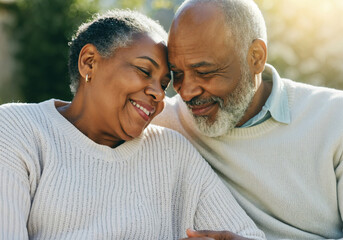 Fototapeta premium Elderly couple enjoying a peaceful moment together, heads touching and smiling